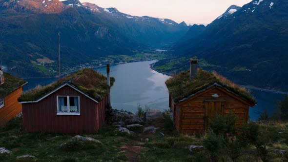 Image of small cottages overlooking a fjord.